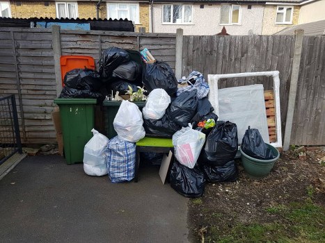 Waste clearance team removing items from a property in South West London